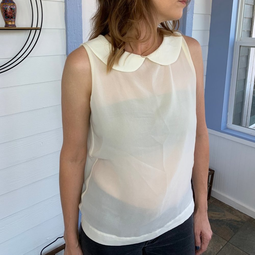 Sheer cream sleeveless blouse